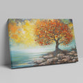 Impressionistic painting of a tree with golden autumn leaves by the coast on canvas