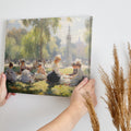 Framed canvas print of a Victorian picnic in a sunlit park with ladies in period attire