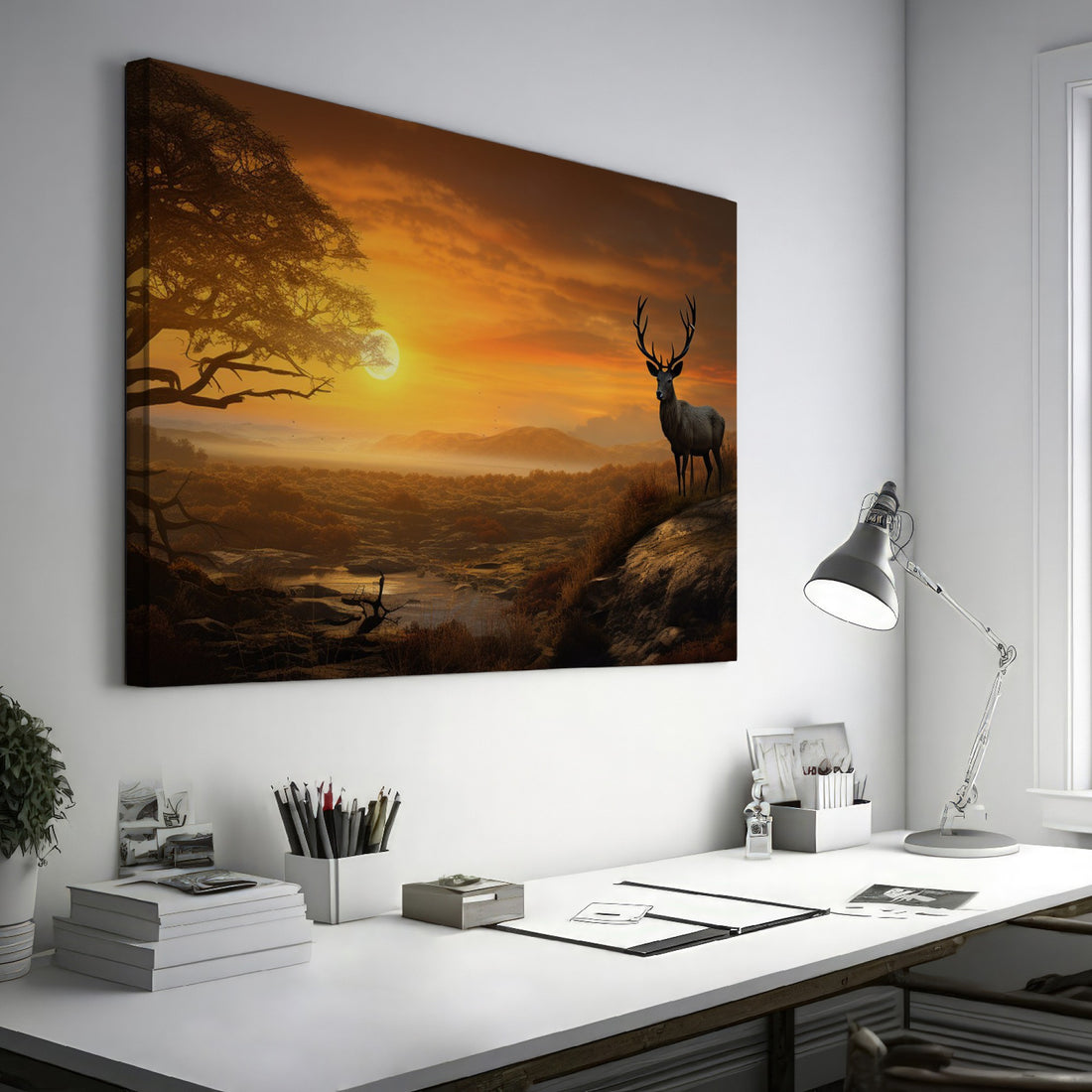 Framed canvas print of a majestic stag in a savanna sunset landscape with warm orange hues