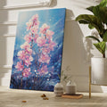 Framed canvas print of radiant pink orchids against a blue backdrop with watercolor textures