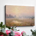 Framed canvas print of a misty countryside meadow with a sunrise and soft pastel colours