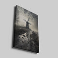 Framed canvas print of a misty Dutch windmill landscape with dramatic sky and reflection in puddle