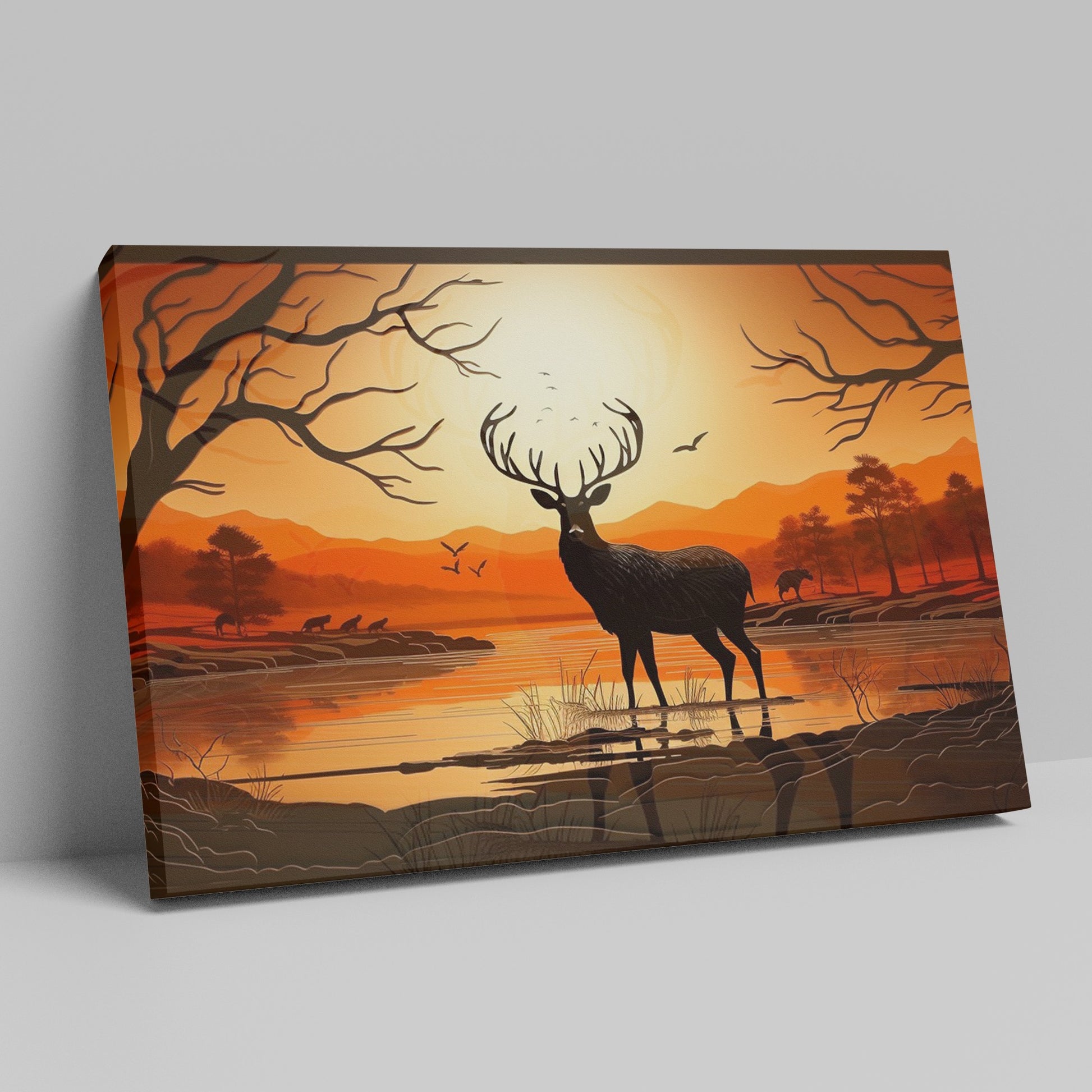 Printed canvas art of a black deer silhouette against an orange sunset with trees and mountains