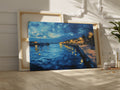 Framed canvas print of twilight seascape with vivid blue waters and illuminated harbour lights