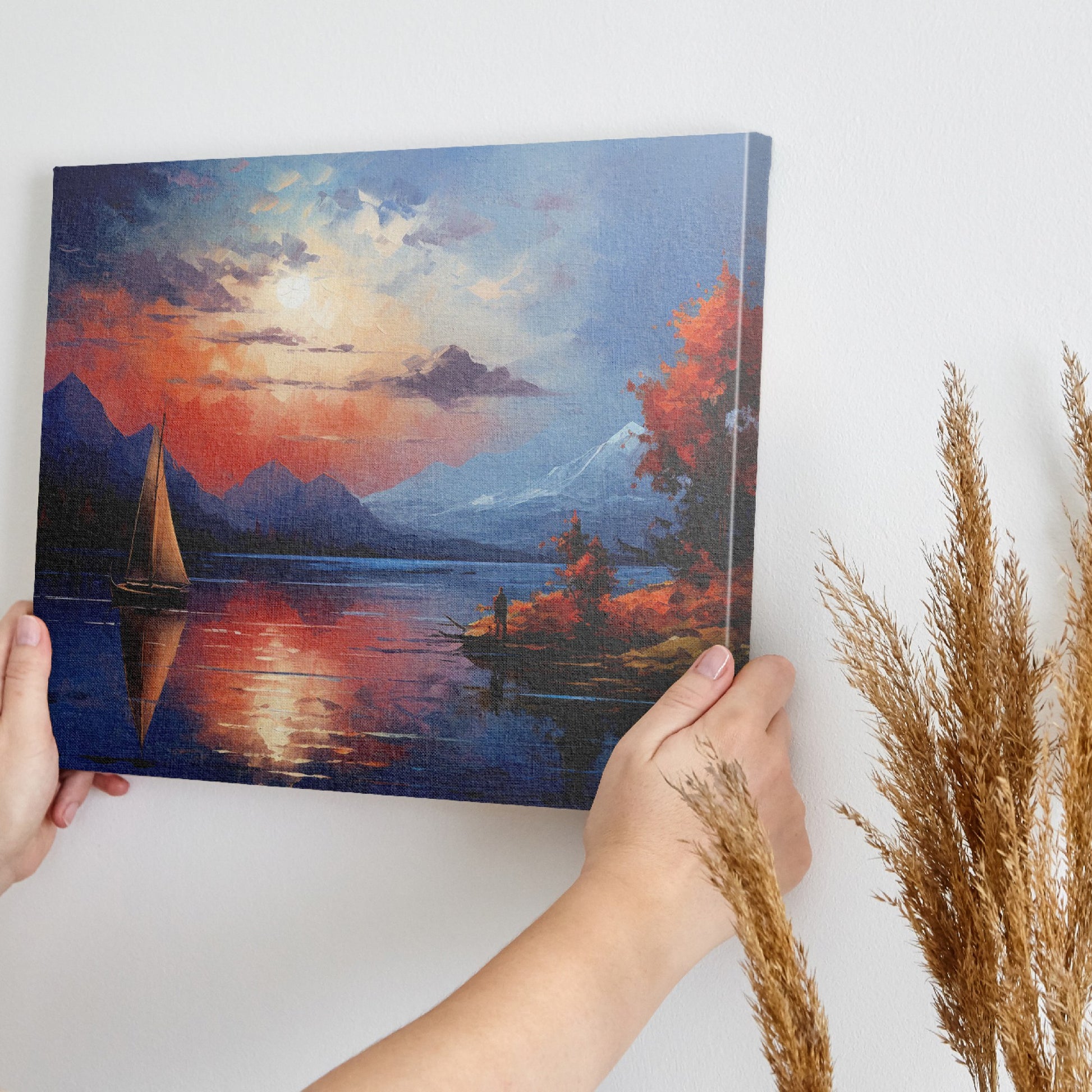 Framed canvas print of an impressionist landscape with a sailboat during sunset, featuring autumnal colours and mountain scenery