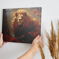 Framed canvas print of a majestic lion in an autumn forest with vibrant red and orange leaves