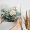 Framed canvas print of tranquil lotus flowers and water lilies on a serene pond