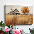 Framed canvas print of a rustic barn in autumn with golden fields and a leafy tree