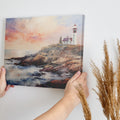 Framed canvas print of an impressionist lighthouse at sunset with vibrant colours