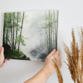 Framed canvas print of a misty bamboo forest in watercolour style with green and grey hues