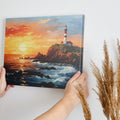 Framed canvas print of a sunset seascape with a lighthouse on a cliff