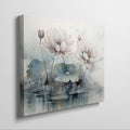 Framed canvas print of watercolour lotus flowers with pastel pink and blue tones