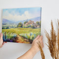 Framed canvas print of a Tuscan landscape with a villa and vineyards