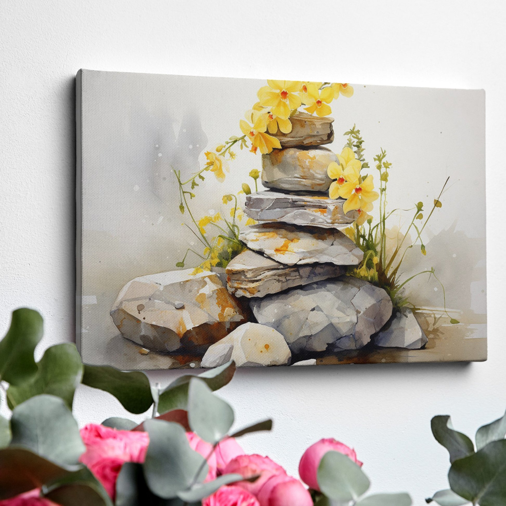 Framed canvas print of watercolour stones stacked with yellow flowers