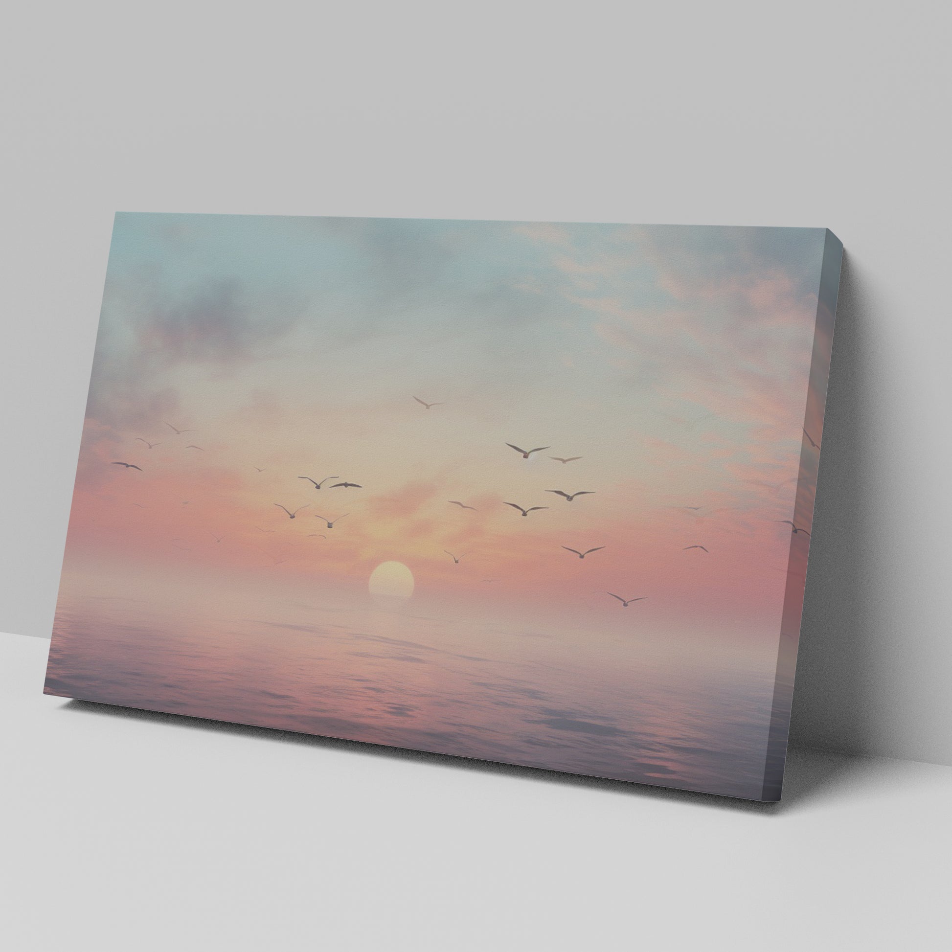 Framed canvas print of a tranquil seascape at sunset with birds and pastel skies