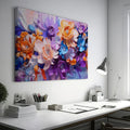 Framed canvas print of vibrant impasto-style abstract flowers in orange, lavender, and blue