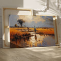 Framed canvas print of a tranquil African savannah landscape with warm sunset and water reflections