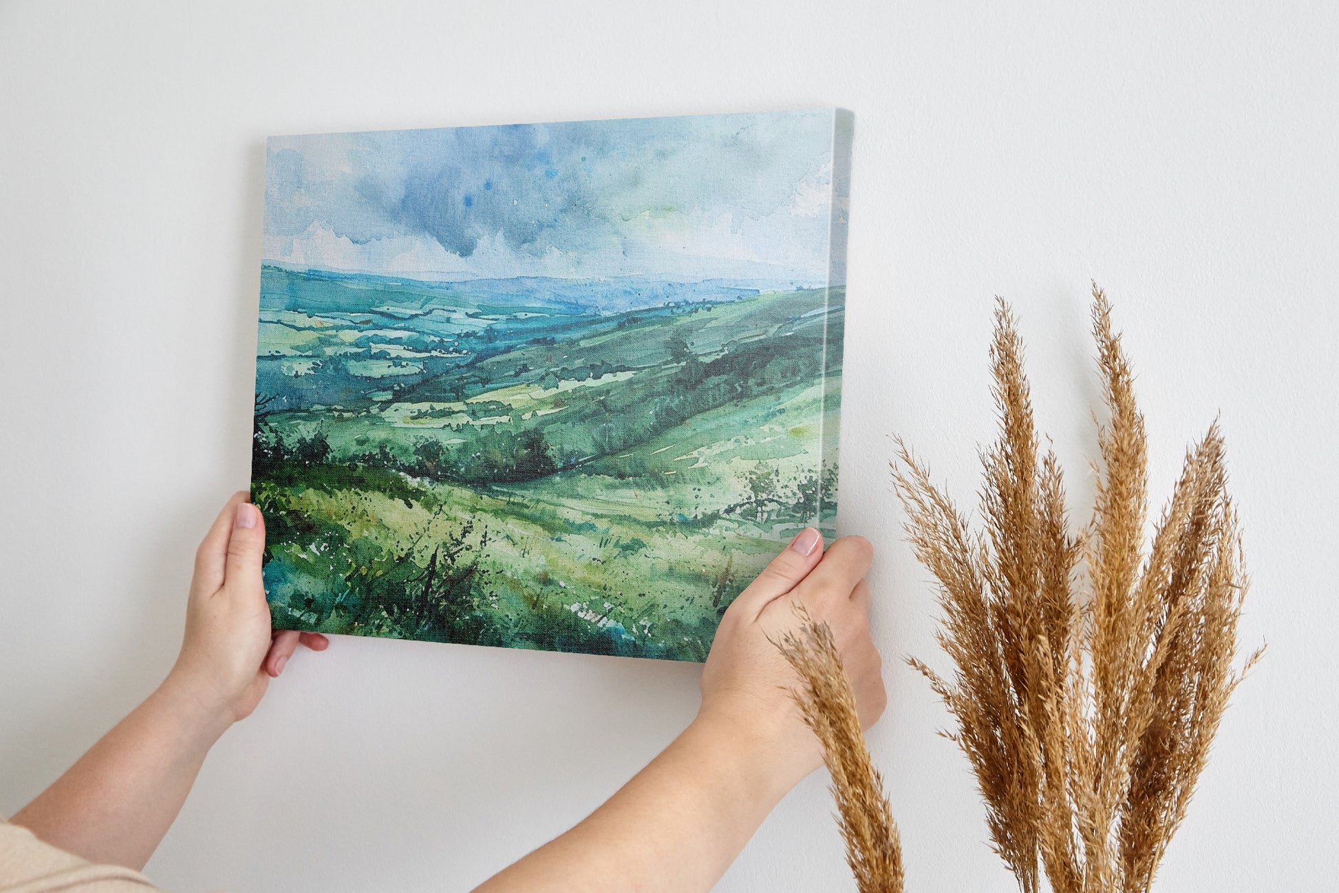 Framed canvas print of a watercolour countryside landscape with green rolling hills and vibrant skies