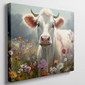 Framed canvas print of a realistic cow in a colourful meadow with wildflowers