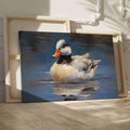 Framed canvas print of an impressionistic painting of a duck on water with blue tones