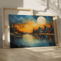 Framed canvas print of vibrant sunset with cityscape reflection over water and textured brush strokes