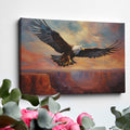 Framed canvas print of a majestic eagle in flight over a canyon at sunset with warm shades of orange and blue