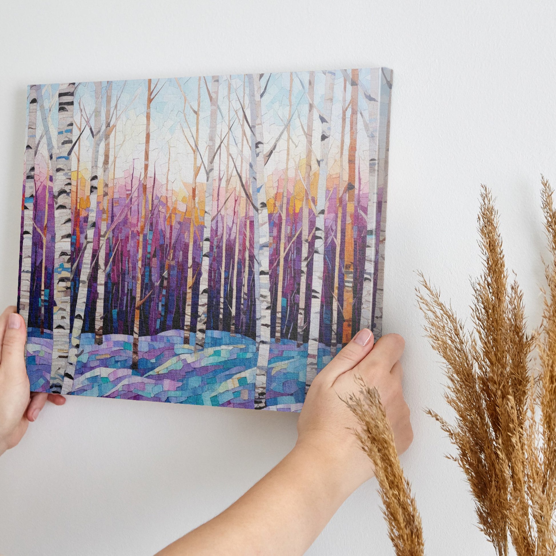 Framed canvas print of a vibrant geometric mosaic depicting an abstract birch forest with coloured leaves and sunset backdrop