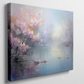 Framed canvas print of impressionist lakeside scene with blooming cherry blossoms and tranquil water reflections in pastel colours.