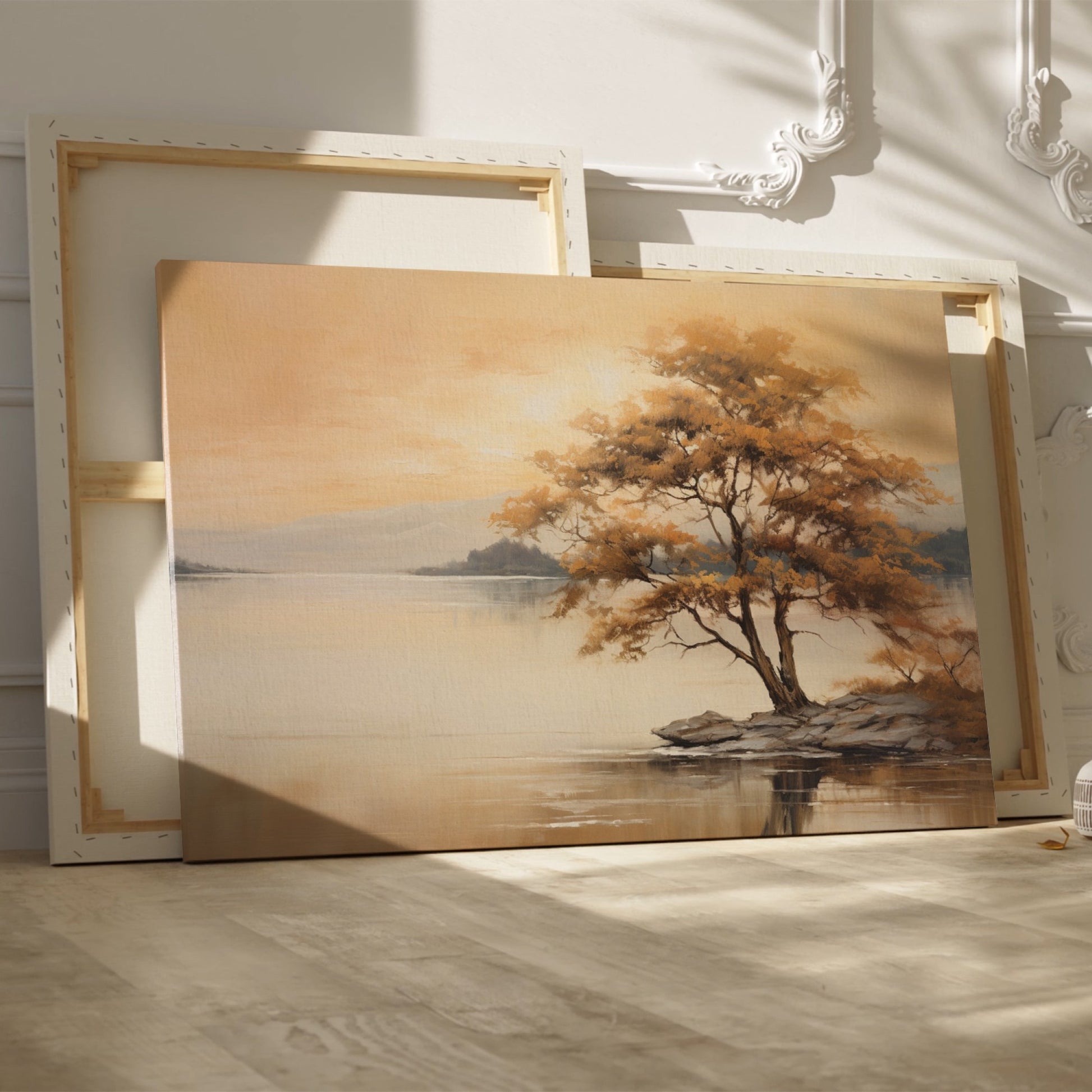 Autumnal landscape with a golden tree on a lakeshore and reflection in the water