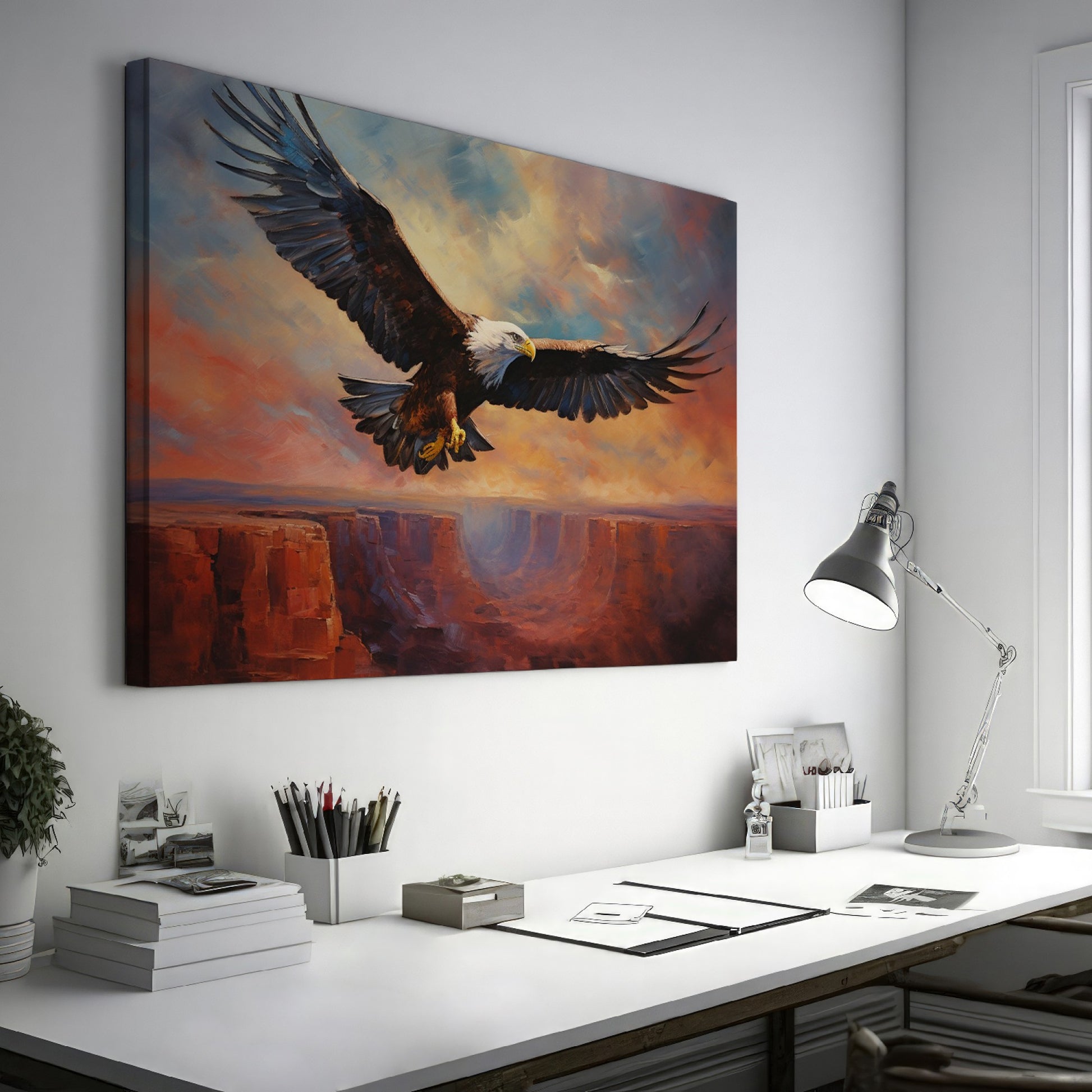 Framed canvas print of a majestic eagle in flight over a canyon at sunset with warm shades of orange and blue