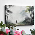 Framed canvas print featuring a solitary figure walking through a misty, ethereal bamboo forest cast in a monochrome colour scheme