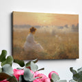 Framed canvas print of a woman in a white dress gazing at a misty sunrise over a golden field