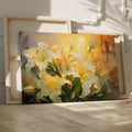 Framed canvas print of impressionist lilies in warm shades of yellow and cream