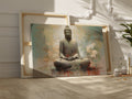 Framed canvas print of Buddha in meditation with abstract background and floral accents