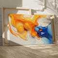 Framed canvas print of vibrant orange and blue abstract fluid art