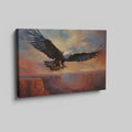 Framed canvas print of a majestic eagle in flight over a canyon at sunset with warm shades of orange and blue