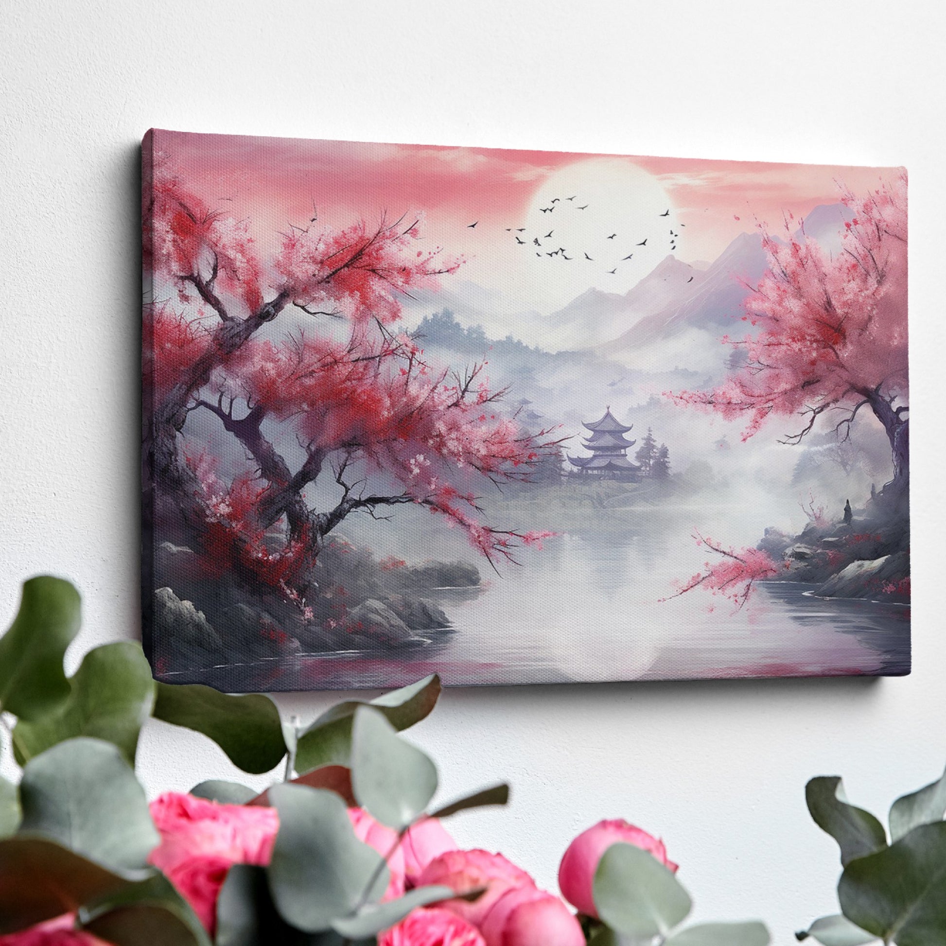 Framed canvas print of an Asian landscape with cherry blossoms and a pagoda at sunset