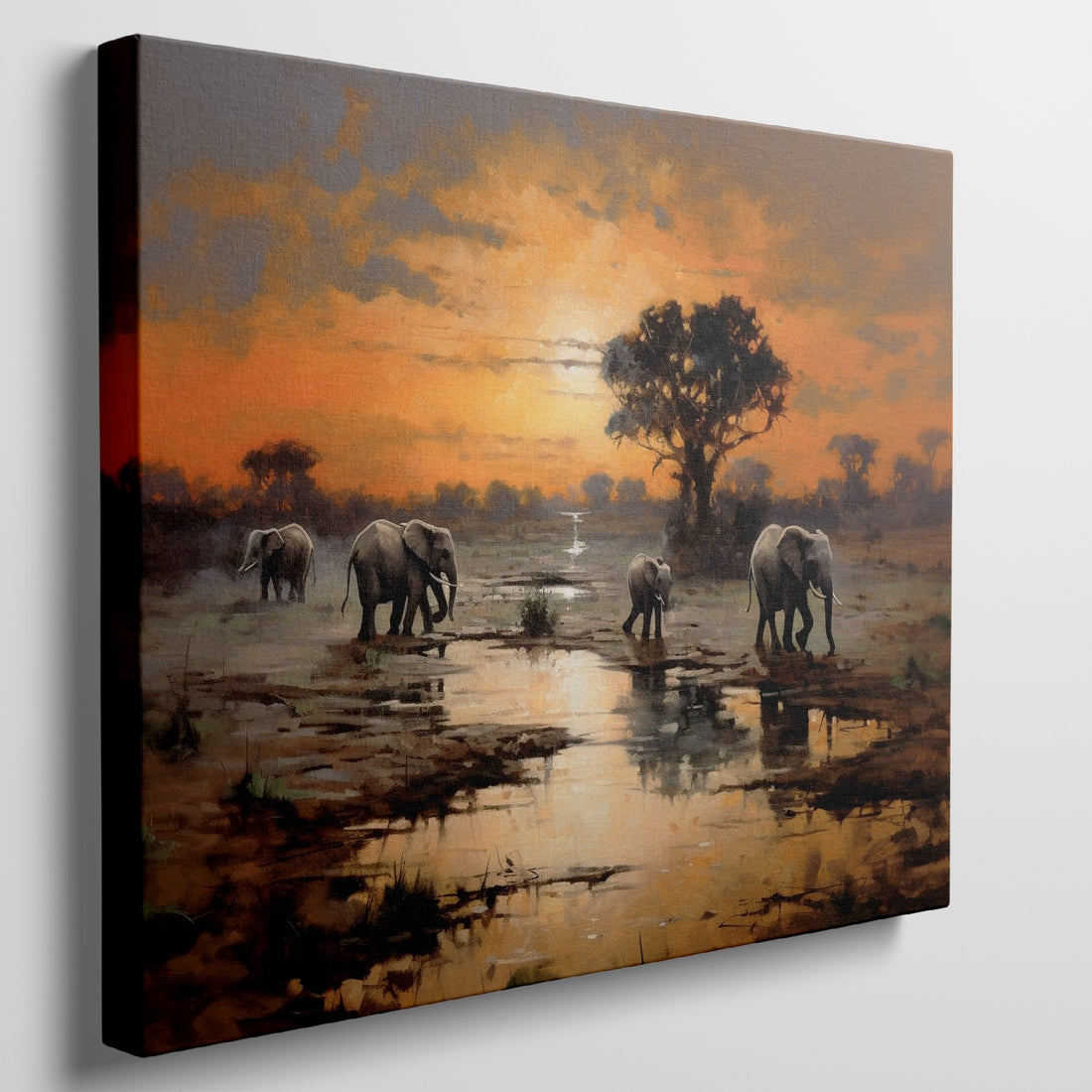 Framed canvas print of African elephants walking beside water during a vibrant sunset