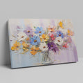 Framed canvas print of vibrant impasto painted flowers in a vase with rich textures and a colourful palette