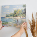 Framed canvas print of an impressionist beach scene with sailboats and people enjoying the shore