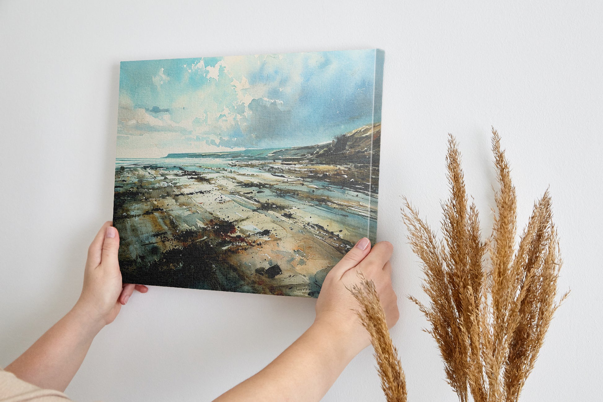 Framed canvas print of a serene watercolour coastal landscape with soft blues and natural earthy tones