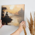 Framed canvas print of a serene Buddha statue at sunset with oriental temple and reflective water