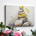 Framed canvas print of Zen stones balanced in watercolour with yellow flowers