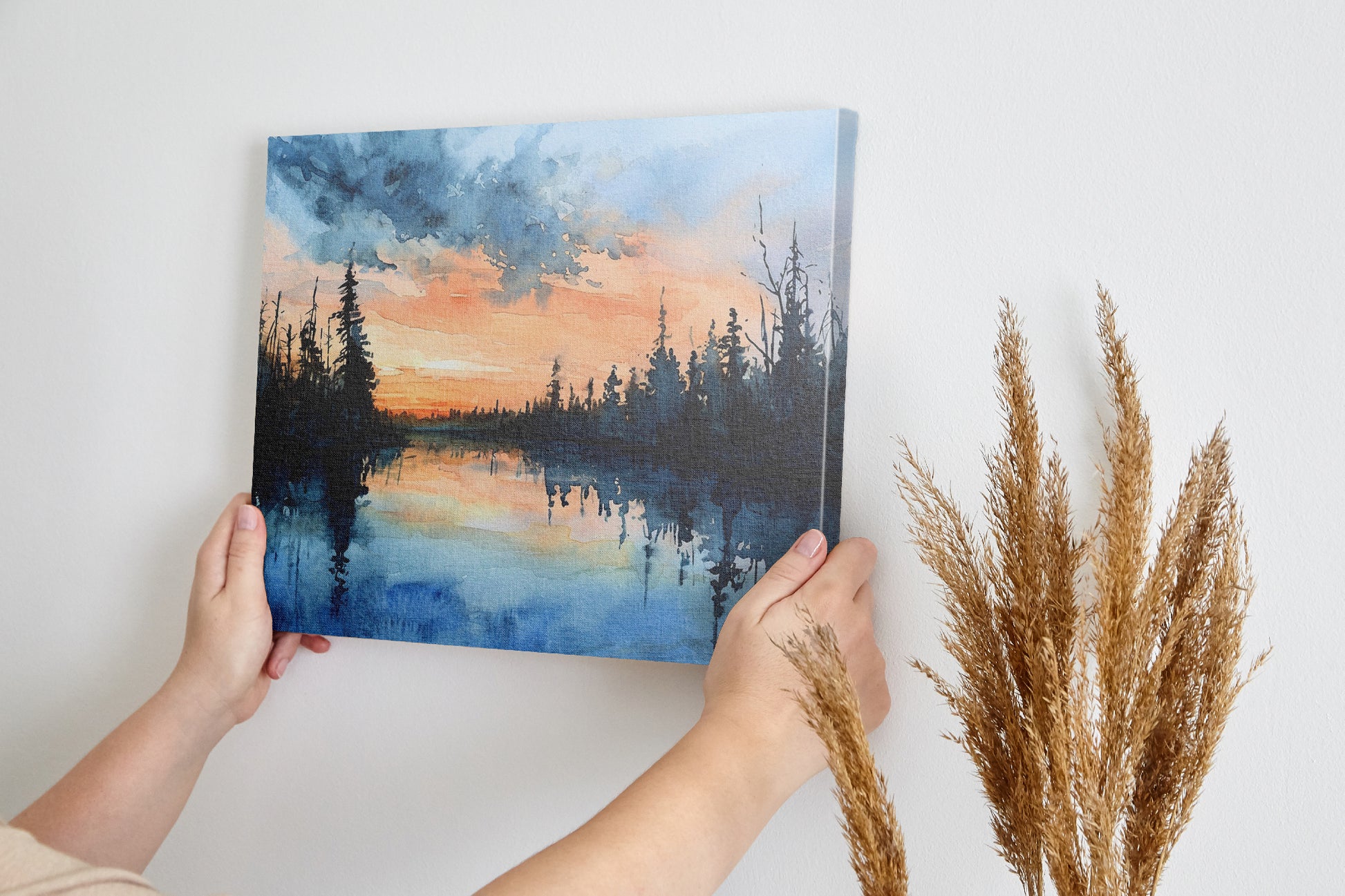 Framed canvas print of a tranquil watercolor landscape depicting a serene lakeside at sunset with reflections of woodland