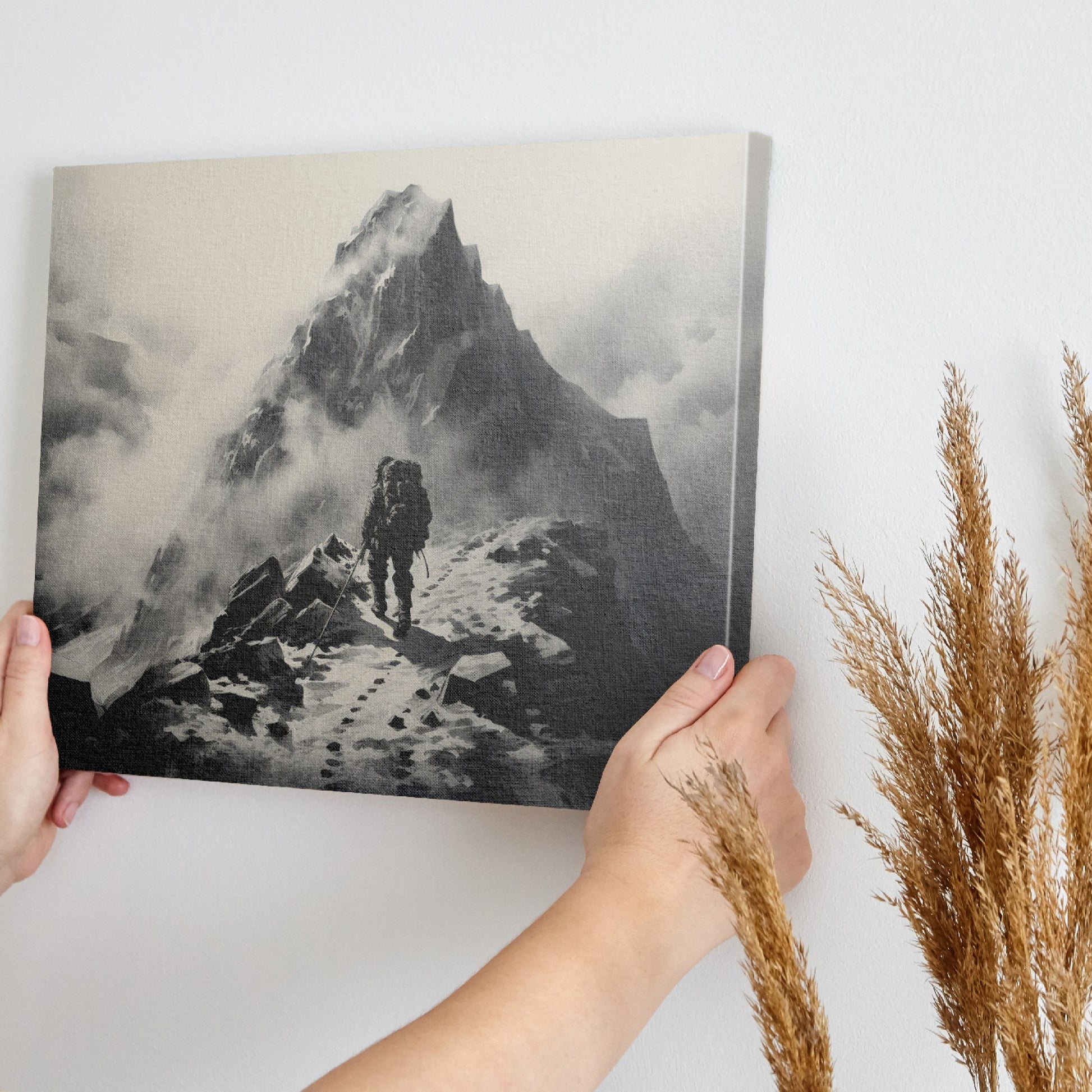 Framed canvas print of a lone mountaineer making their way up a foggy, monochromatic mountain scene