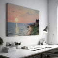 Framed canvas print of an Impressionist seascape with a sunset over the ocean and coastal village