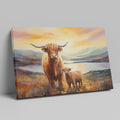 Framed canvas print of Highland cattle in a scenic landscape at sunset with warm hues