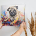 Framed canvas print of a lovable pug entwined with colourful Christmas lights in a painterly watercolour style