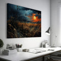 Framed canvas print of a dramatic sunset over a rustic meadow with vivid warm tones