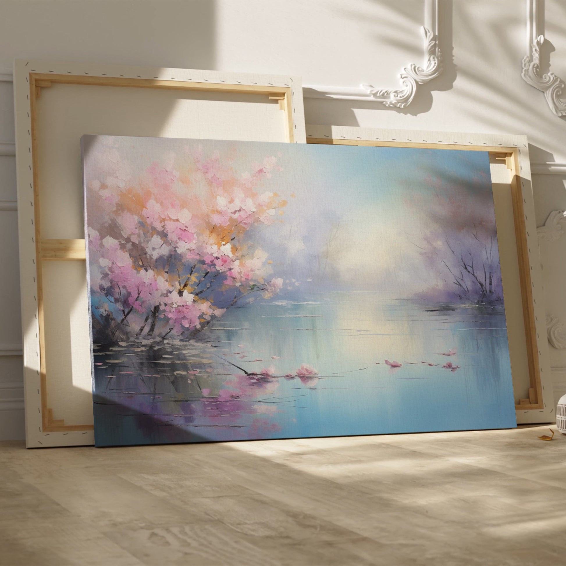 Framed canvas print of impressionist lakeside scene with blooming cherry blossoms and tranquil water reflections in pastel colours.